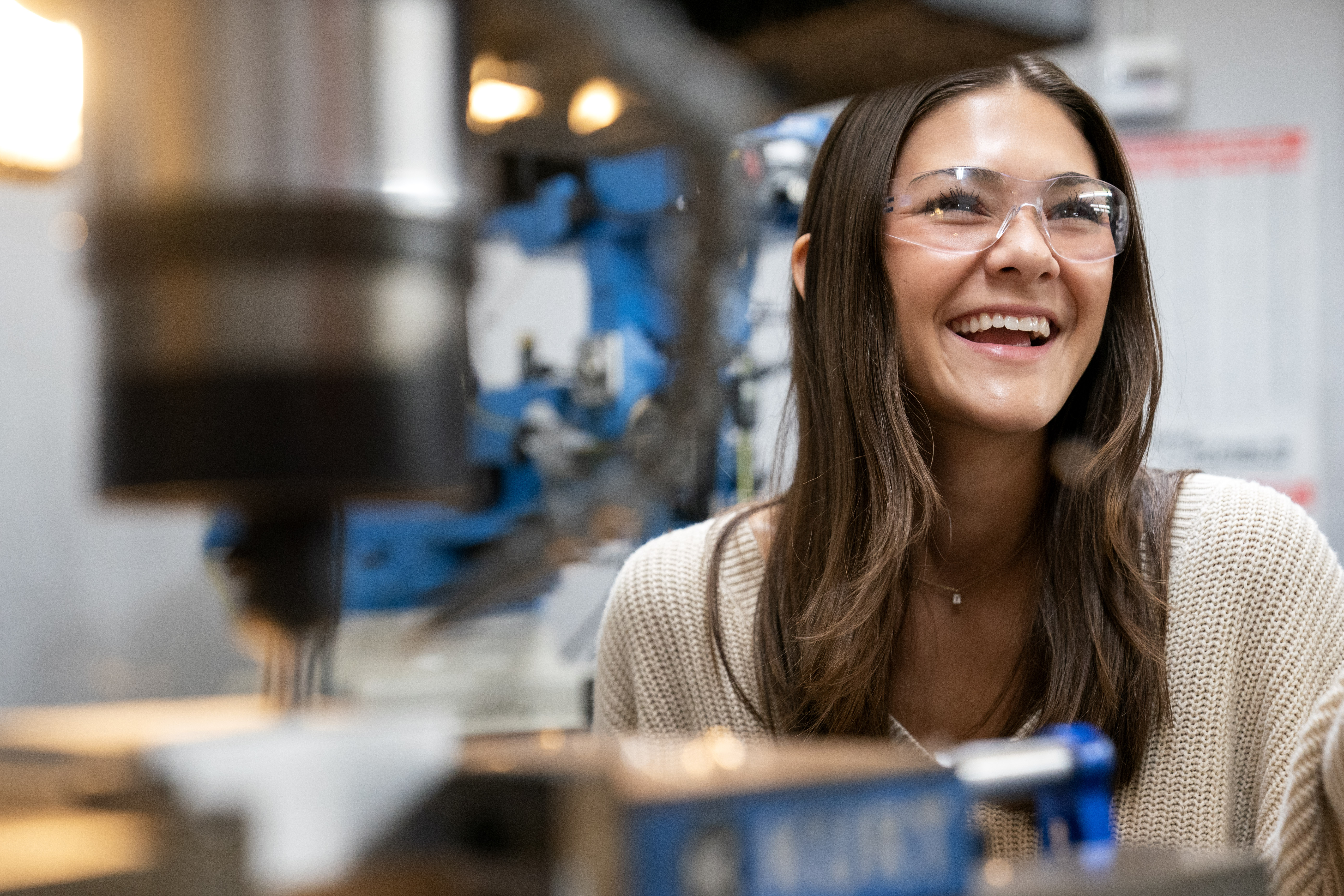 Mechanical Engineering student smiling in machine shop