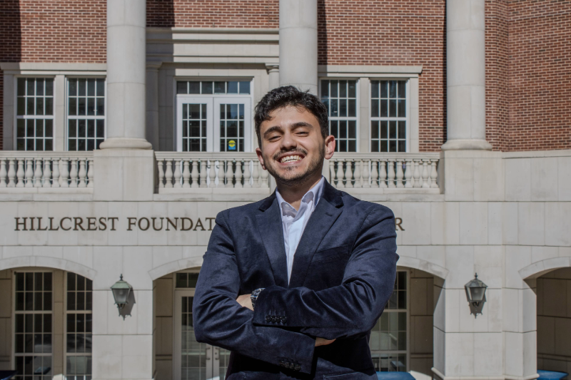 Hussam Khresat stands outside the SMU Lyle School of Engineering in Dallas and smiles.