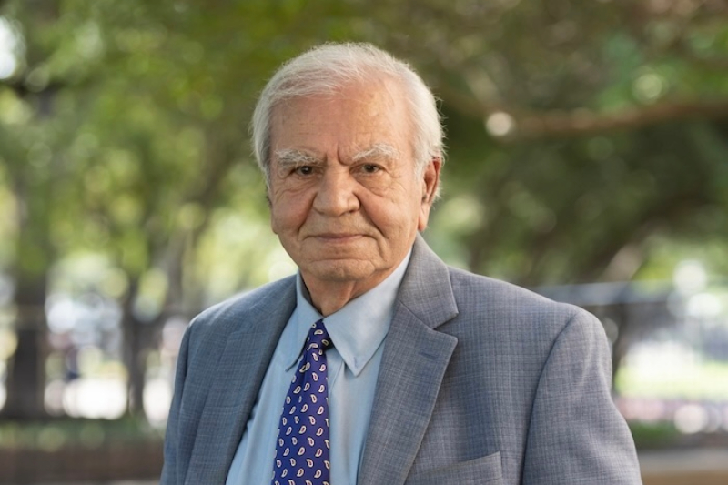 Professor Behrouz Peikari stands outdoors on the SMU campus.