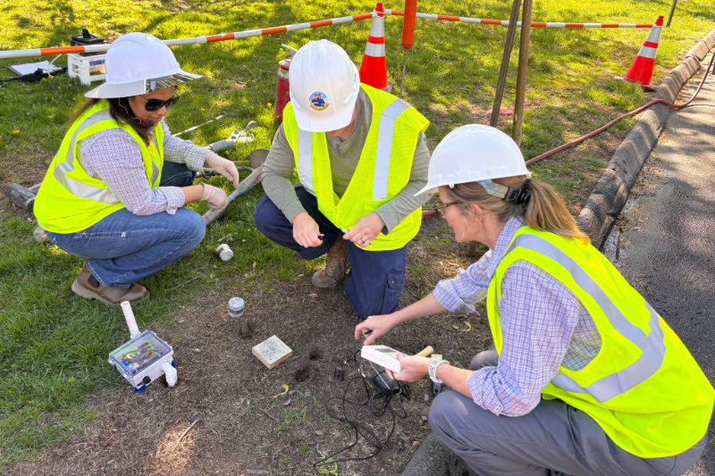 Postdoctoral fellow Dr. Navodi Jayarathne, Graduate student Trevor Webber, and Dr. Kathleen Smits install environmental sensors during recent field work.