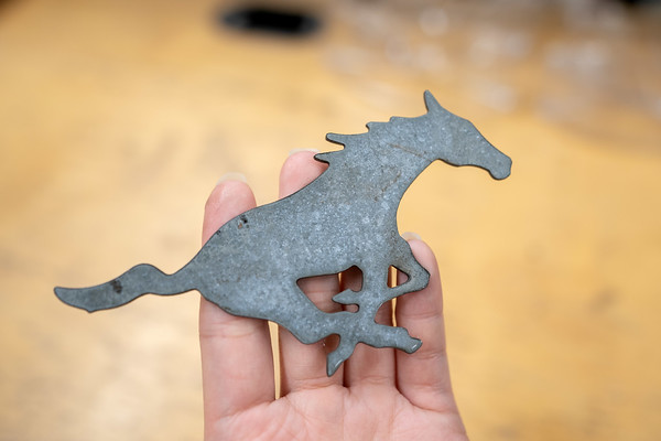 Metal cutout of Peruna from machine shop