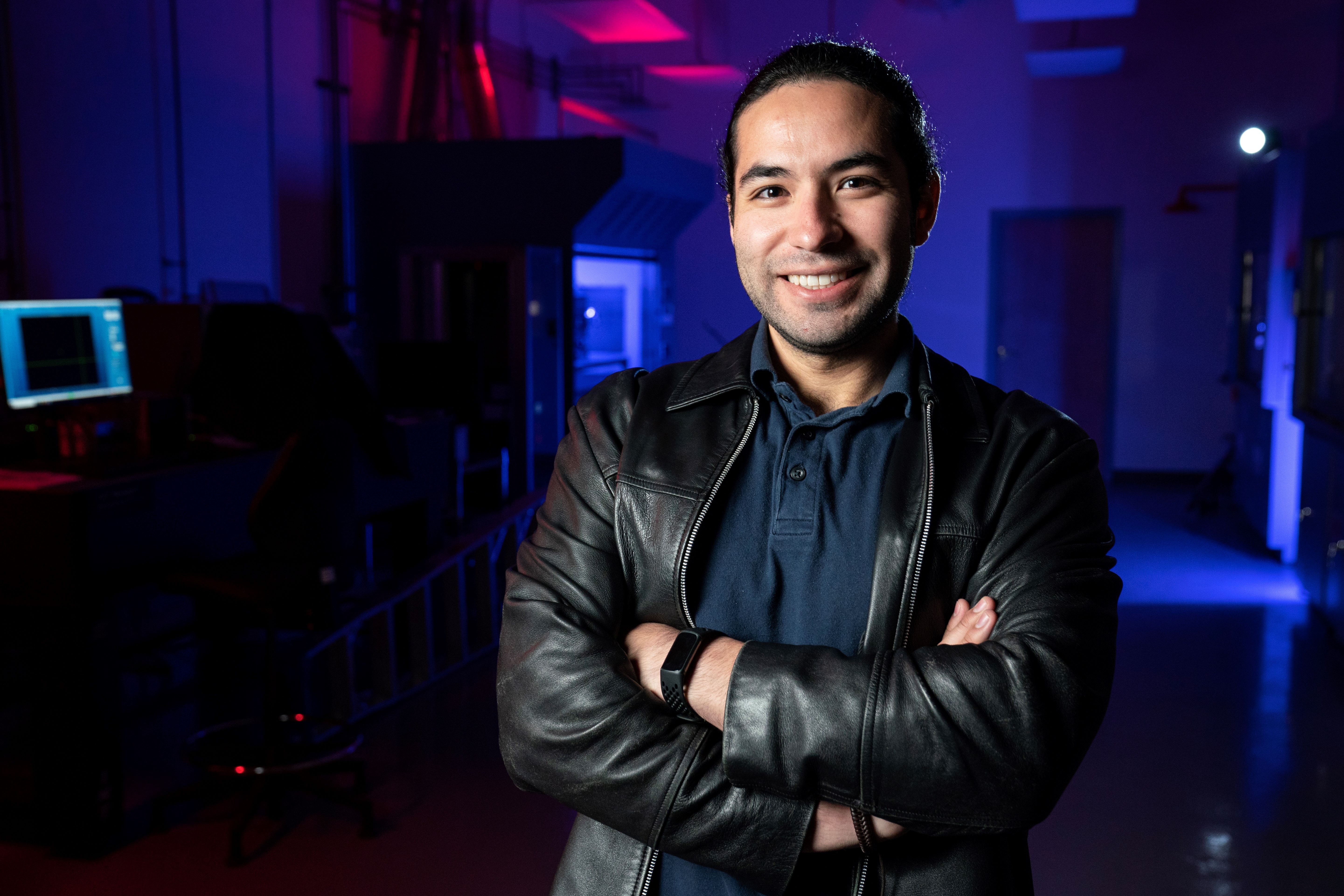 SMU student Alex Avendano Bolivar stands in electrical engineering lab.