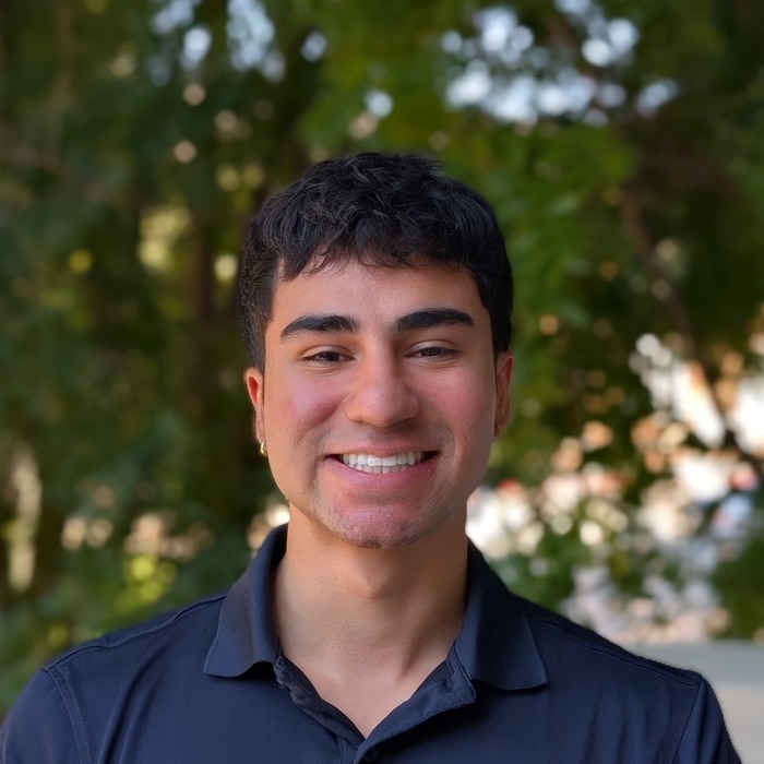 a headshot of aaron santa cruz in smu lyle