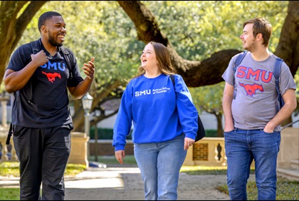 Three students walking through the SMU campus