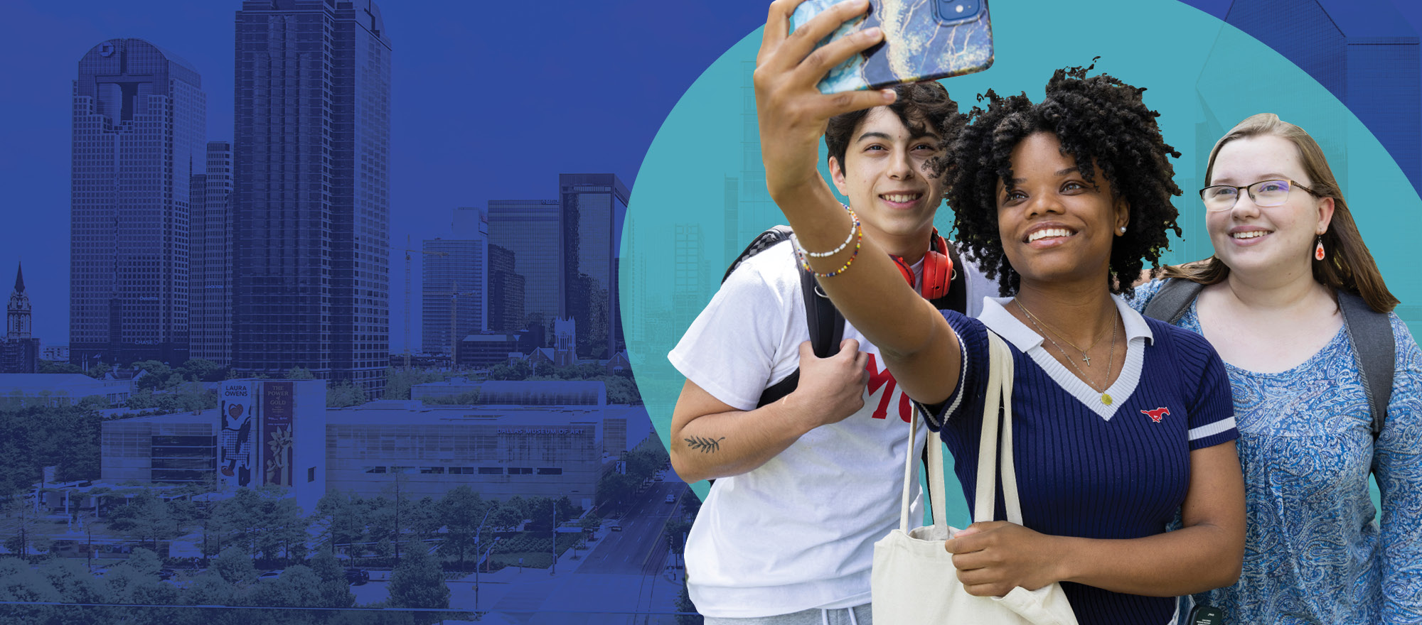 Three people posing for a selfie, one person is holding the camera. 
