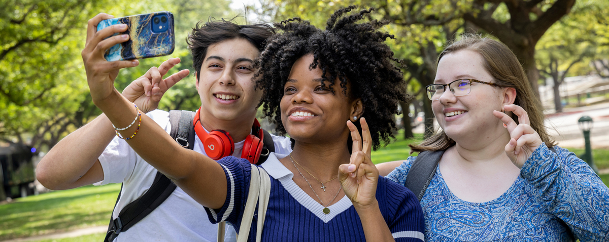 Students on campus taking a selfie