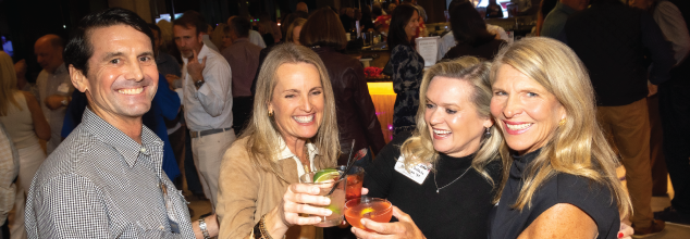 Alumni and guests socializing at a Founders' Day happy hour