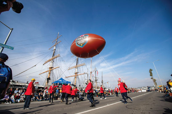 SMU Marching Band and parade performers at the Holiday Bowl Parade in San Diego