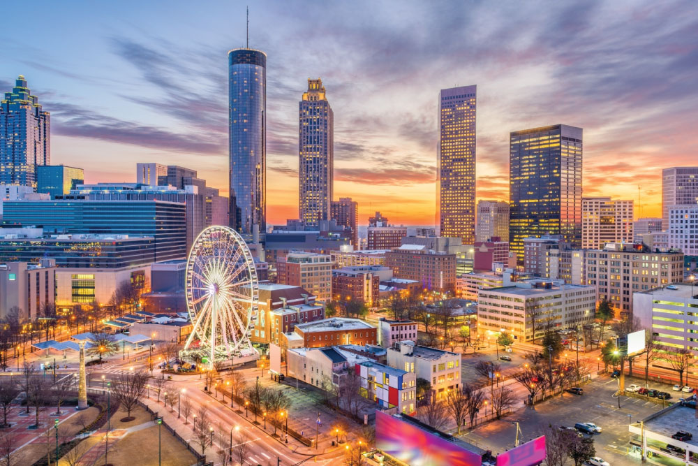 Downtown Atlanta skyline at sunset with the SkyView Ferris wheel.