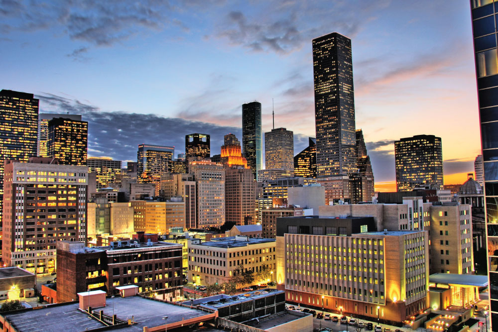 Houston downtown skyline at night with illuminated high‑rises.