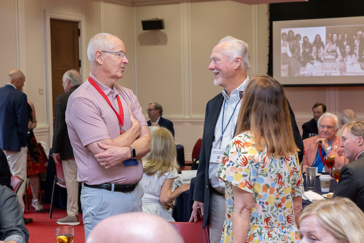 Class of 1975 Classmates talking during reunion