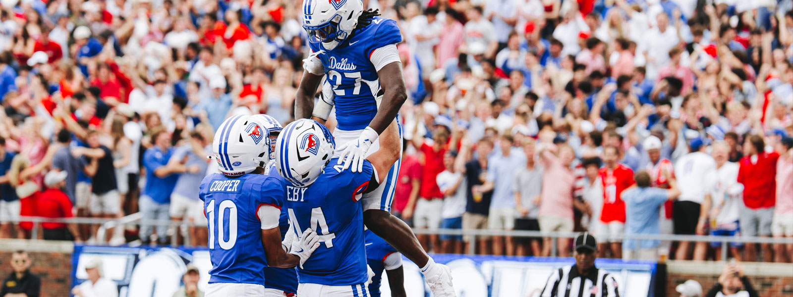 SMU football players celebrating on the field