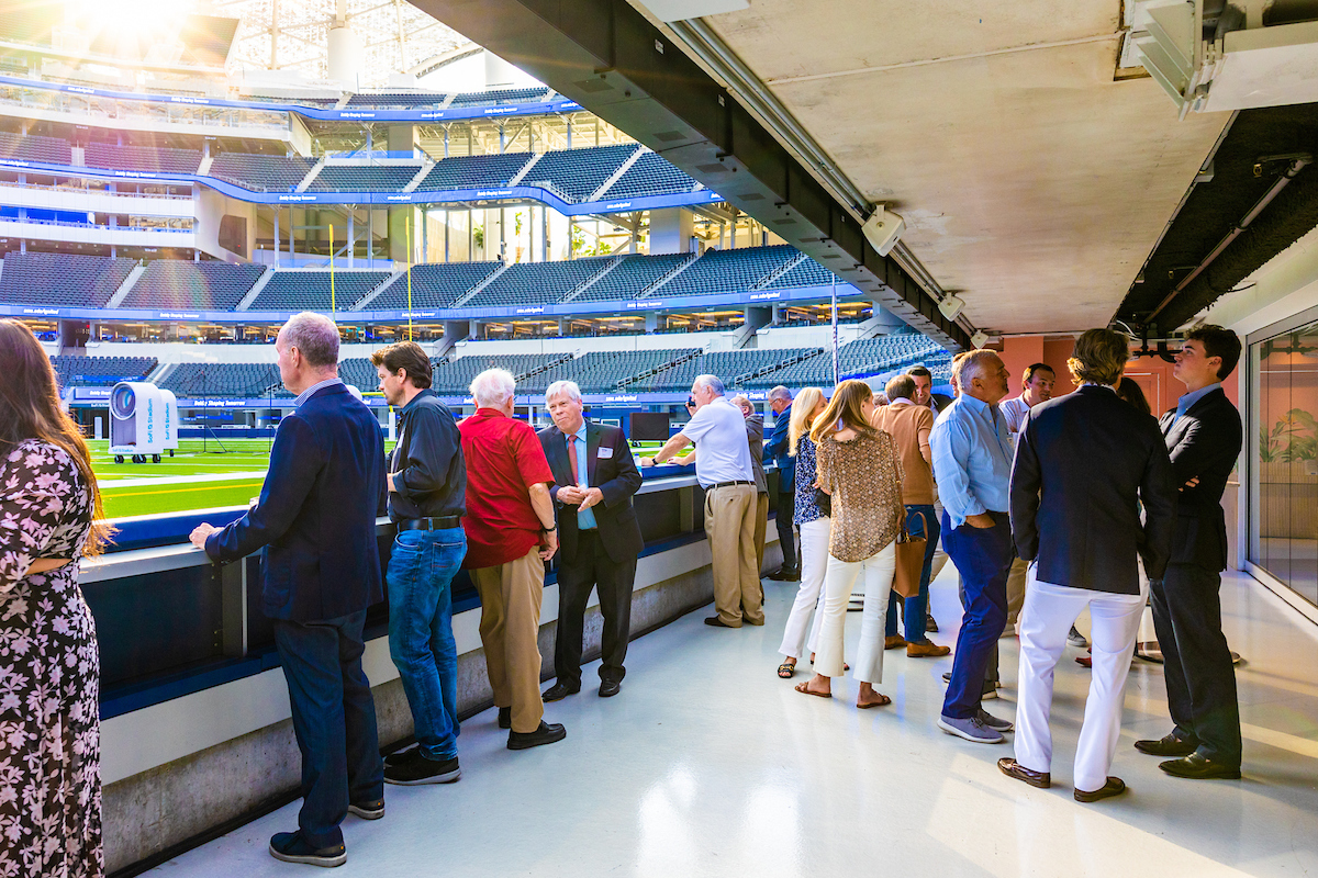 People gathered inside stadium lounge
