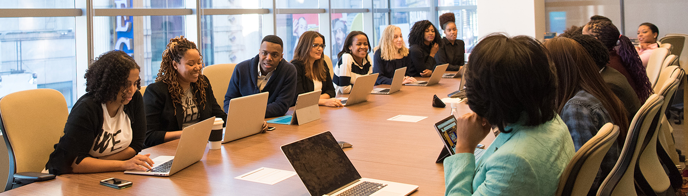People having a meeting around a conference table