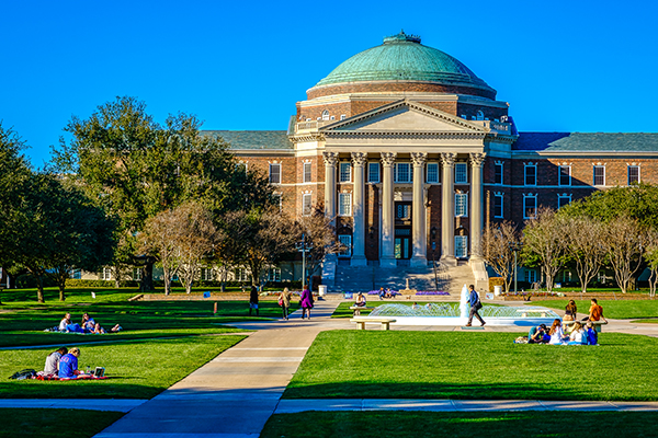 Dallas Hall and students on lawn