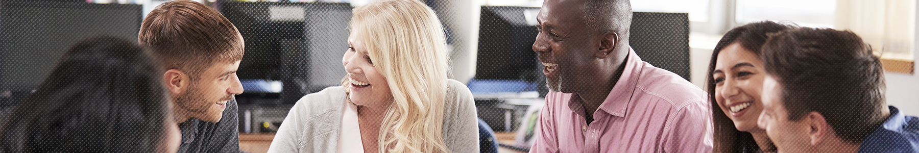 Group of people talking and smiling