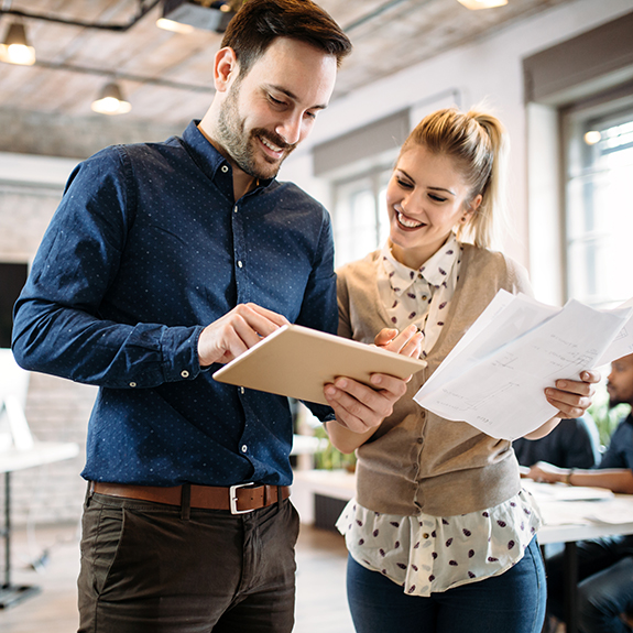 Instructor showing a student something on a tablet