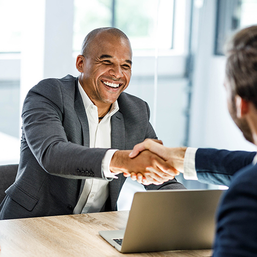 Tech CxO students shaking hands