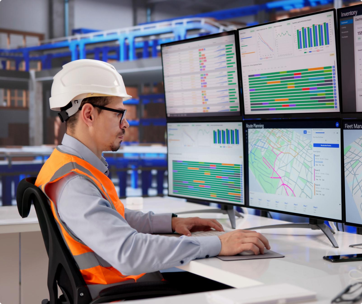 Man looking at computer screen data analytics