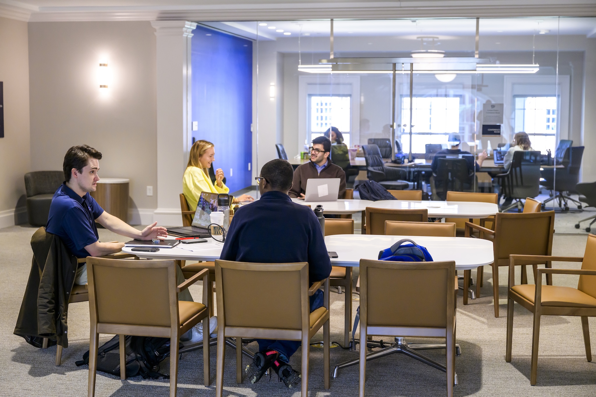 Students in the B.B.A. in Business Analytics and Supply Chain Management at Cox meet in a large, bright conference room.
