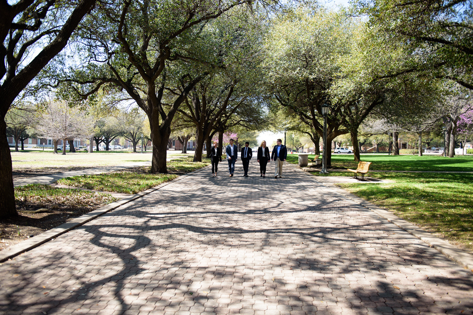 Students walking outside SMU Cox