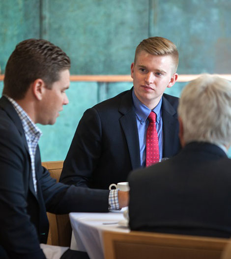 three men at a table