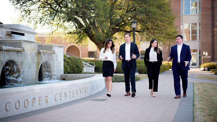 four students walking