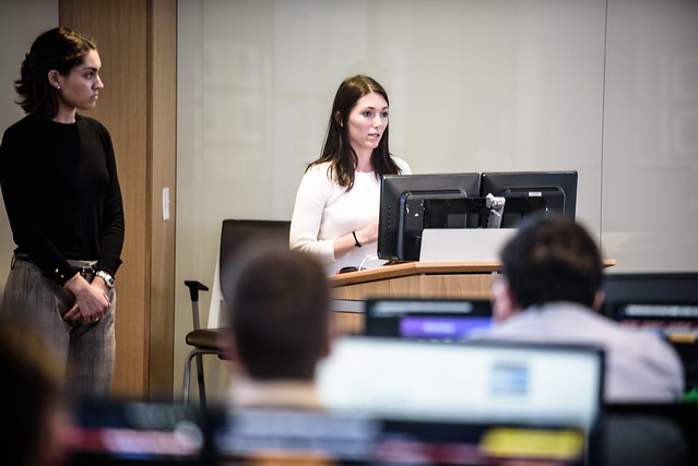 Photo of two students presenting to their class