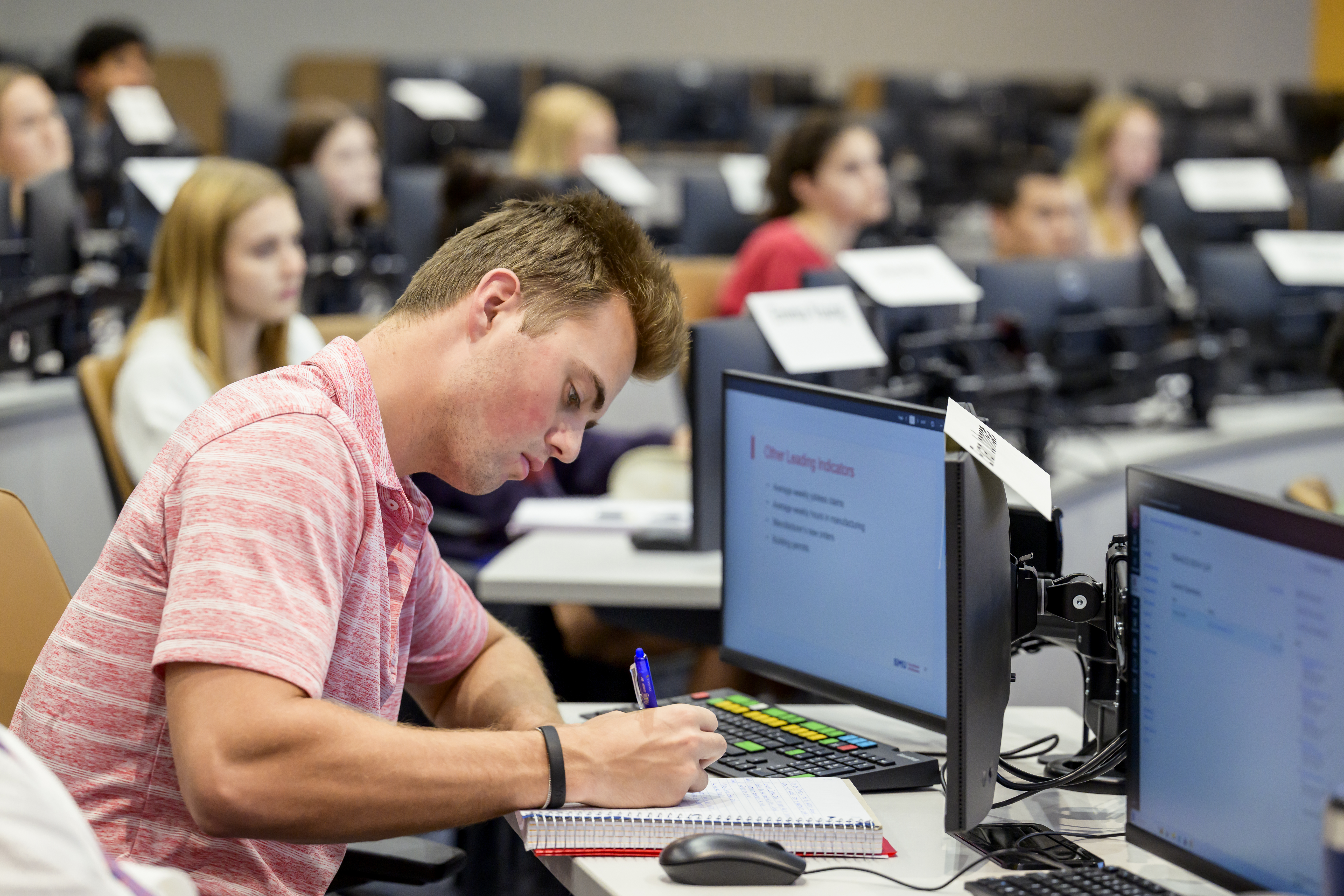 student works in a classroom