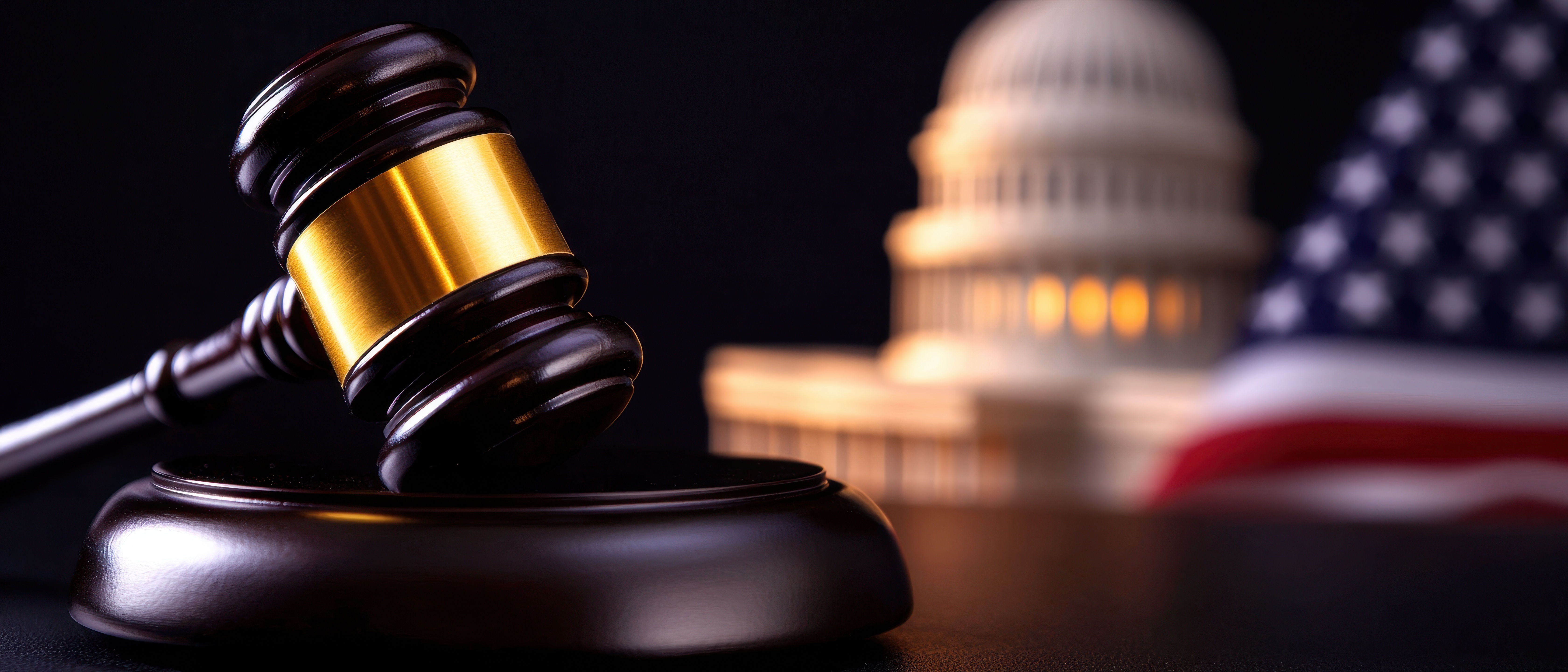 photo of judge's gavel with capitol building in the background