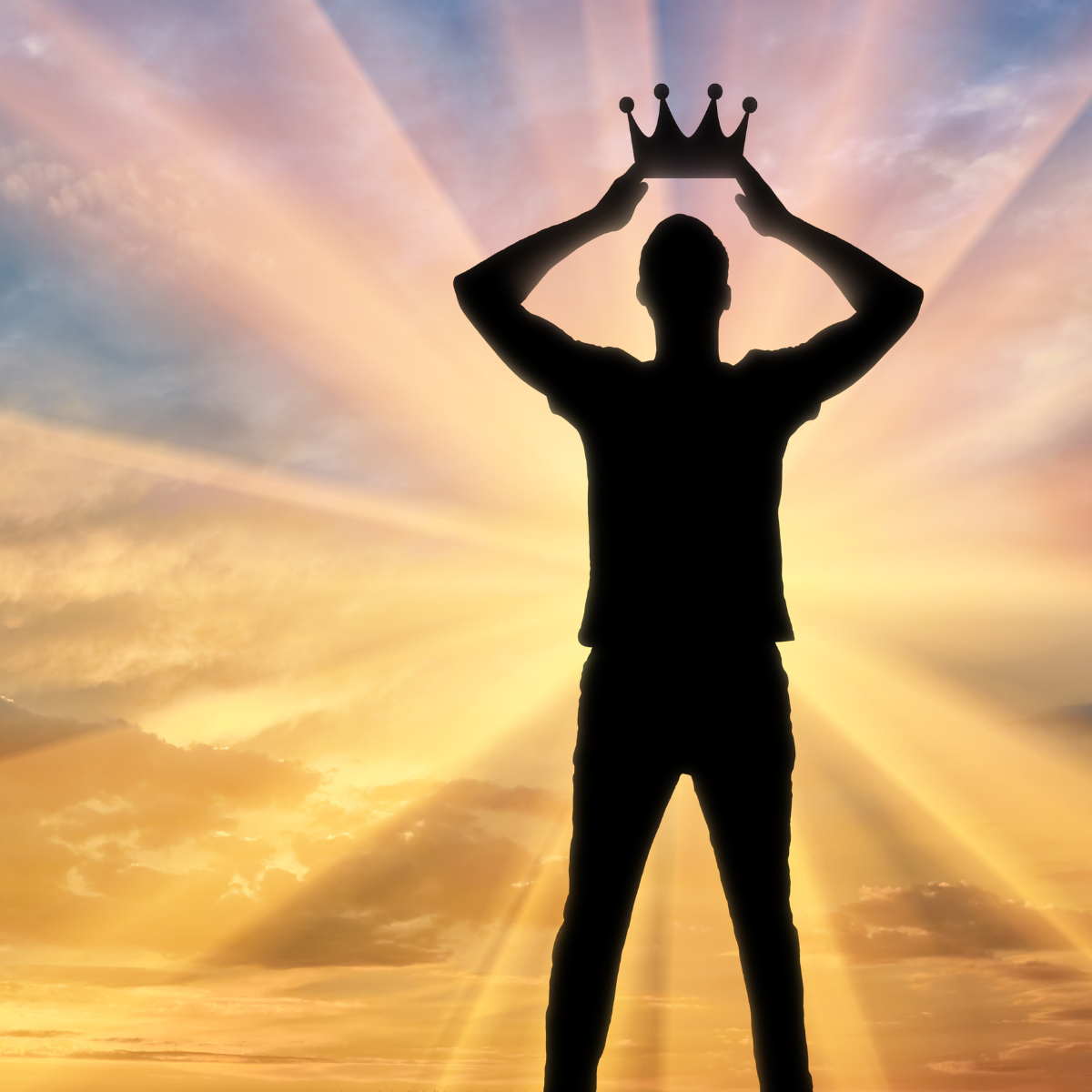 Photo of a person standing with a crown in the sunlight