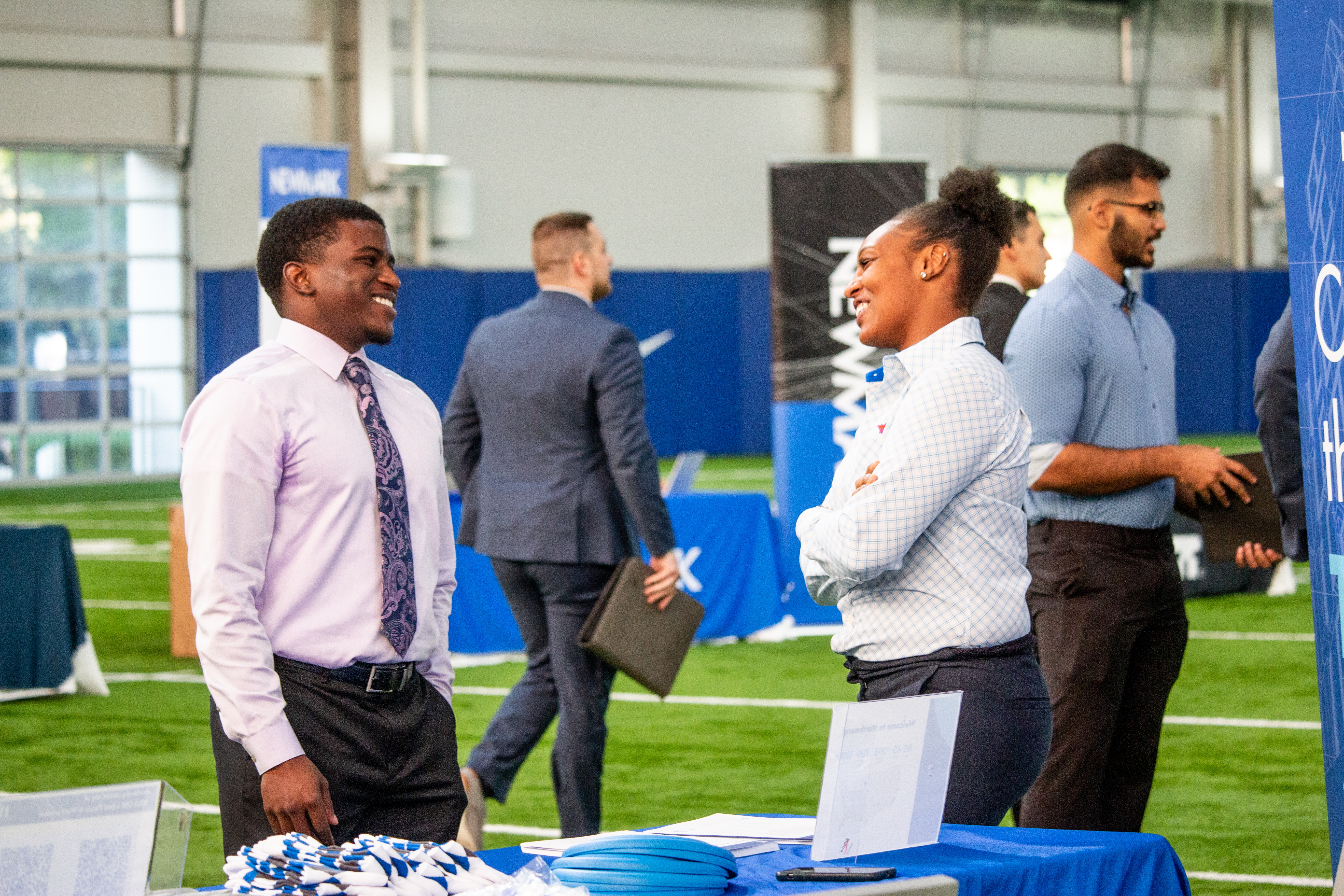 employer speaking with student at career fair