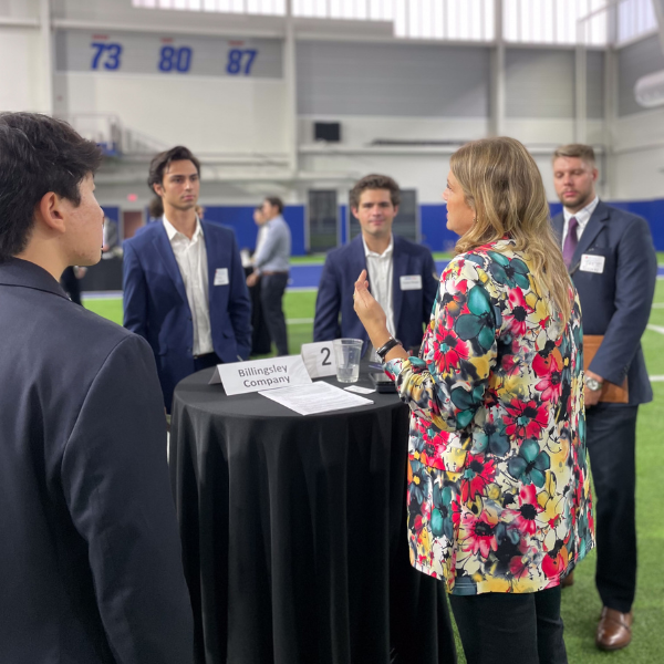 real estate roundtable career fair employer speaking with students
