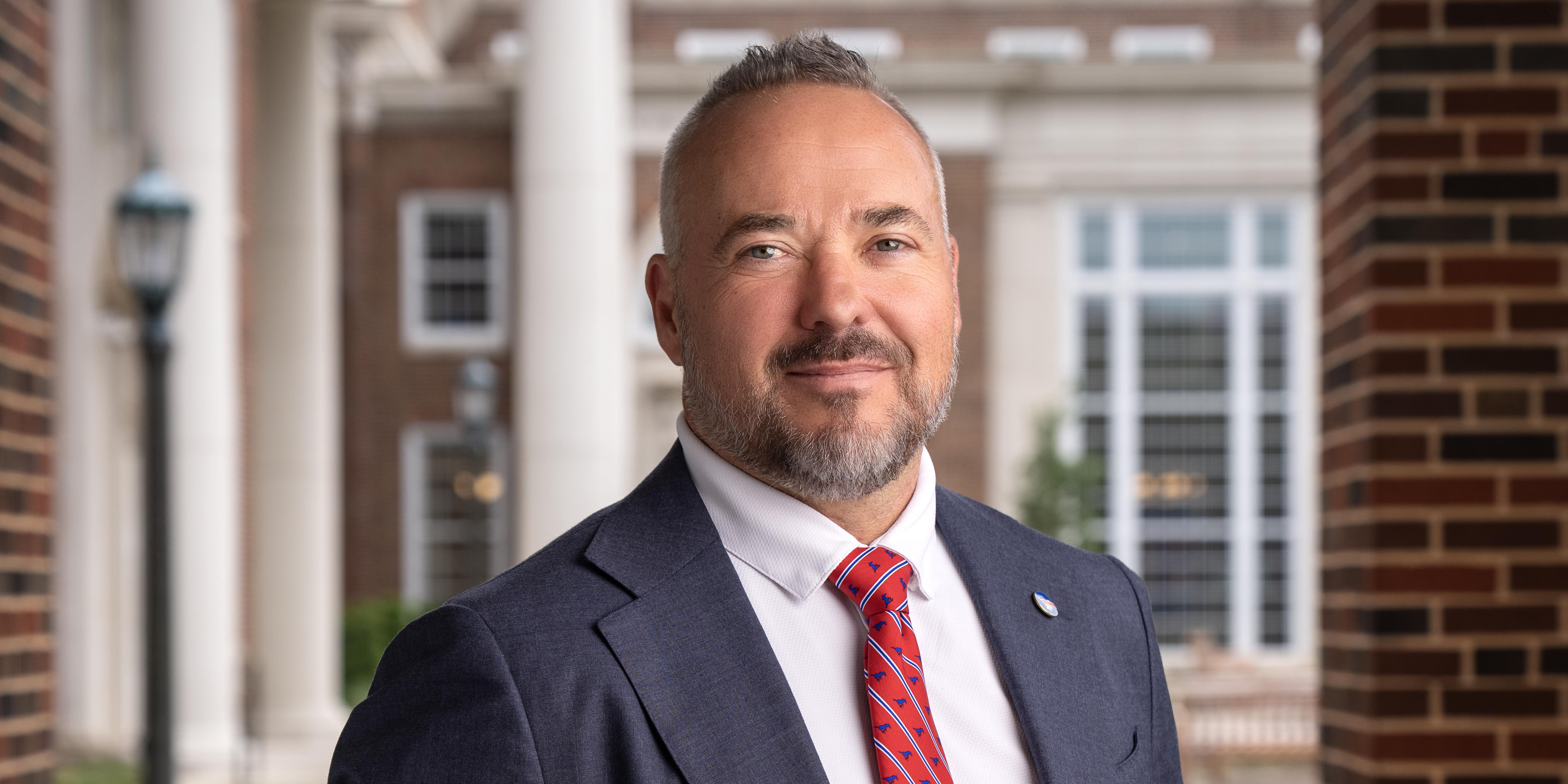 Formal headshot of Dean Todd Milbourn 