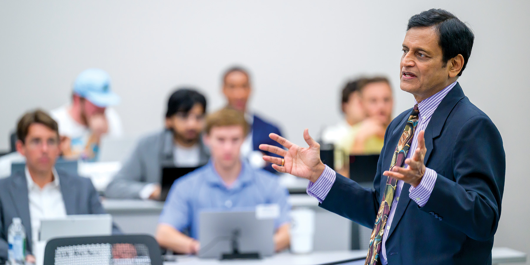 Venky Shankar lectures to students in front of a classroom