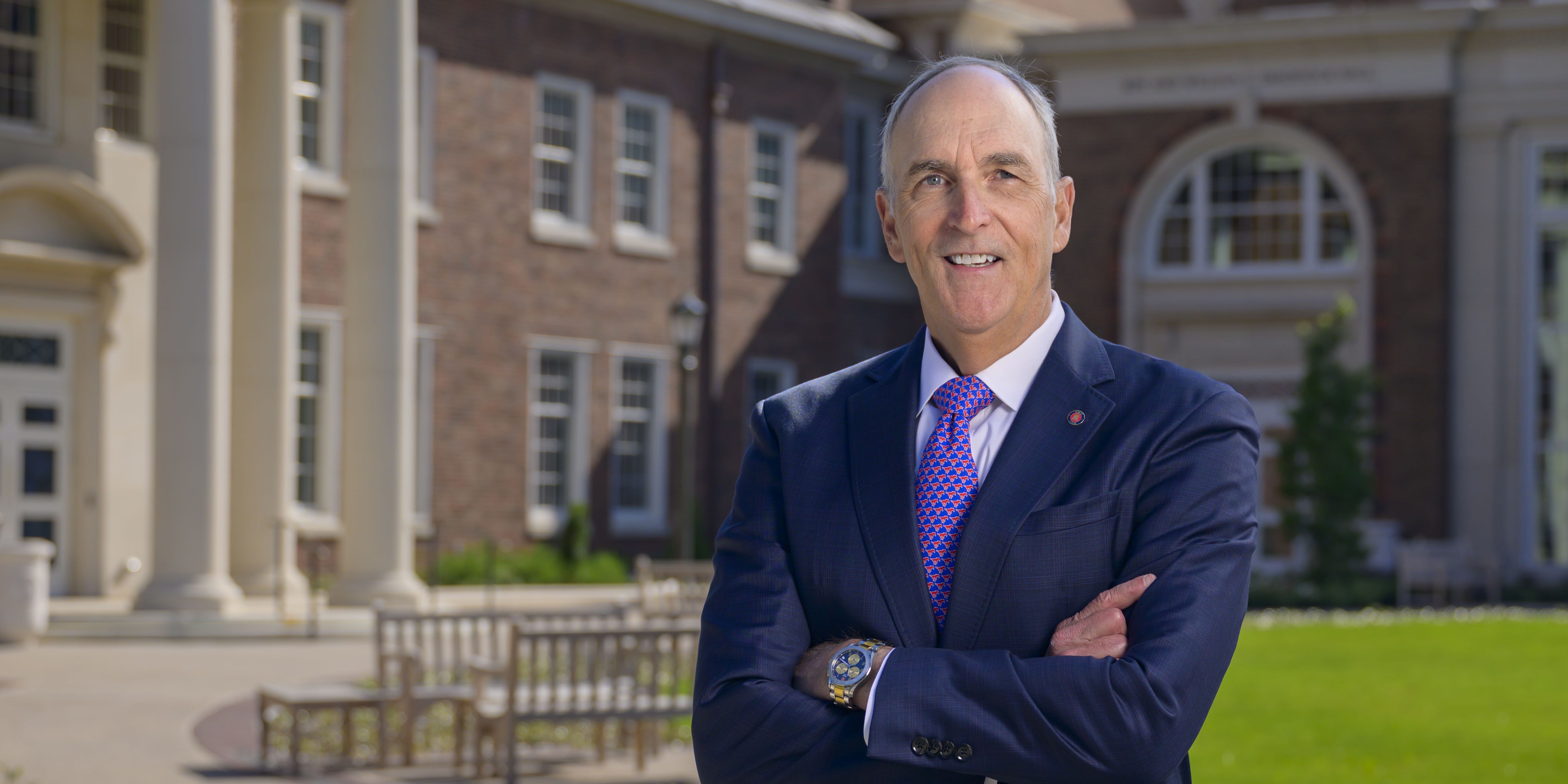 Dean Myers portrait in the courtyard of the David B. Miller Business Quadrangle