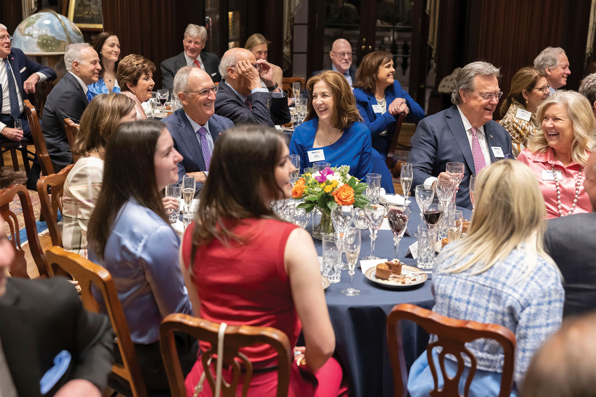 Dean Myers and his family sit together at a round table at the Cox Executive Board dinner in April