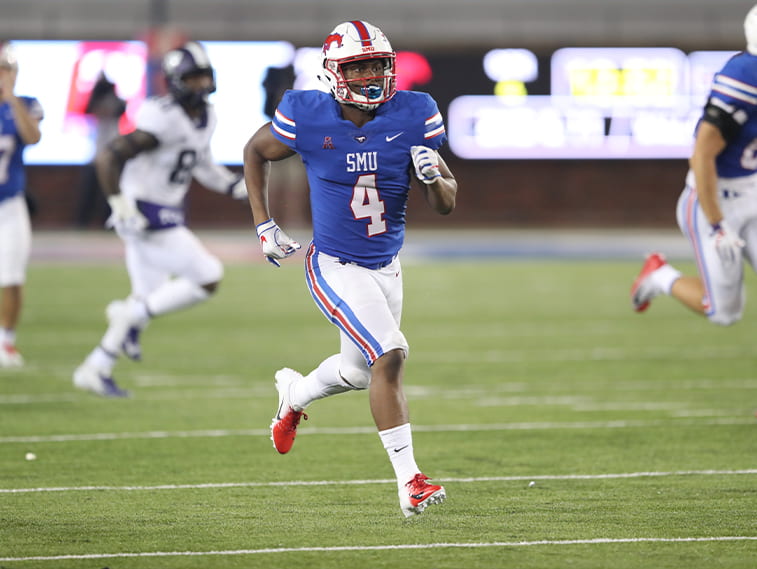 Mustang letterman Mikial Onu, No. 4, running on the football field in his SMU uniform.