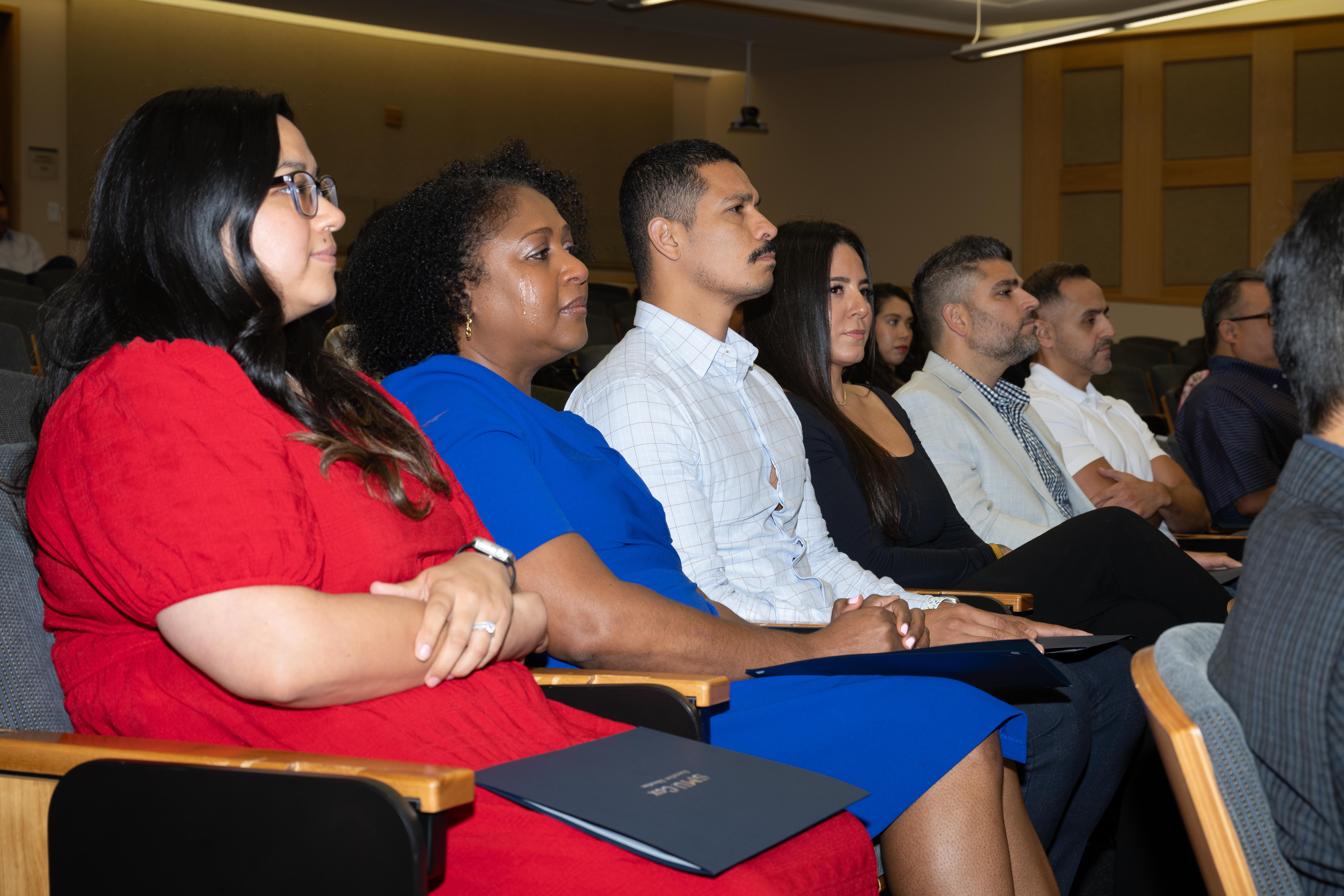 Graduates listening in ceremony