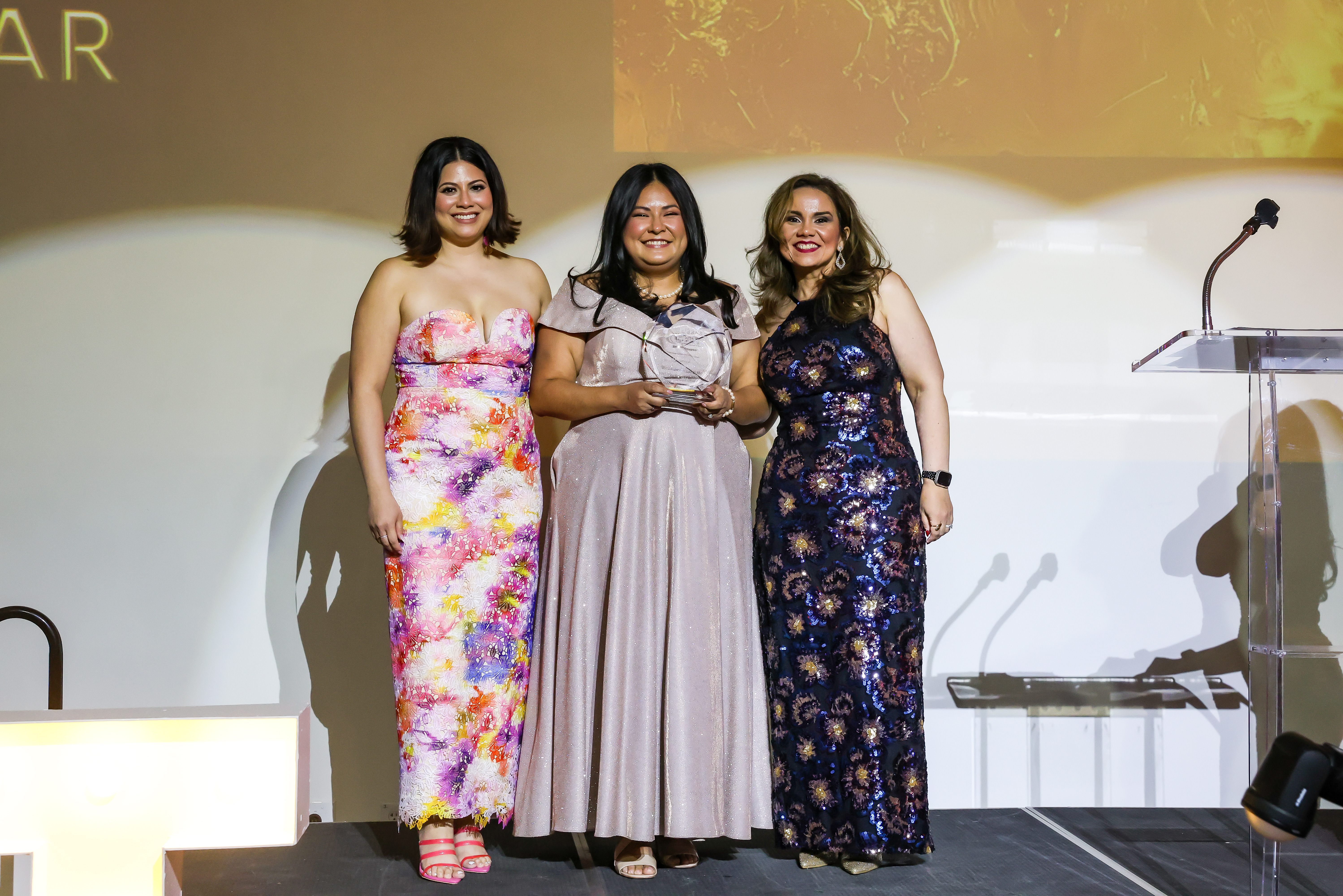 photo of Staphany Lopez-Coronado receiving award