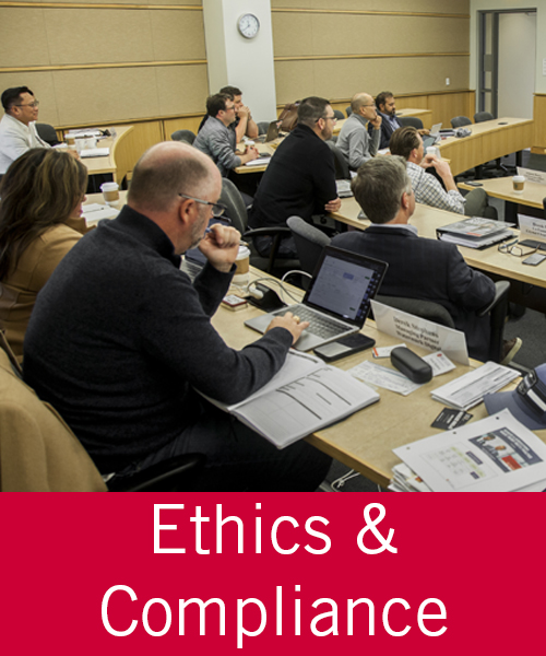 three students at a table working