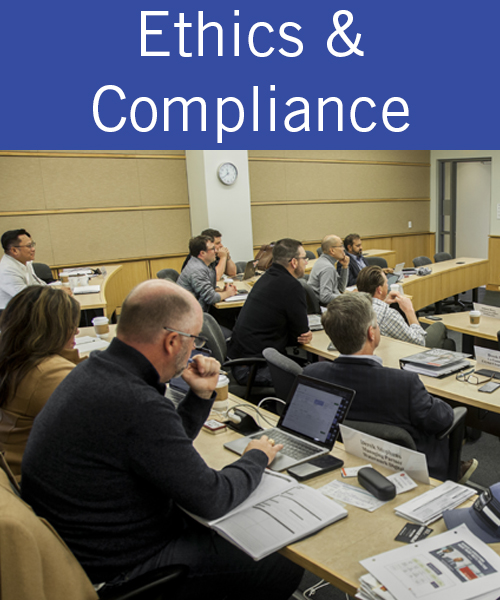three students at a table working