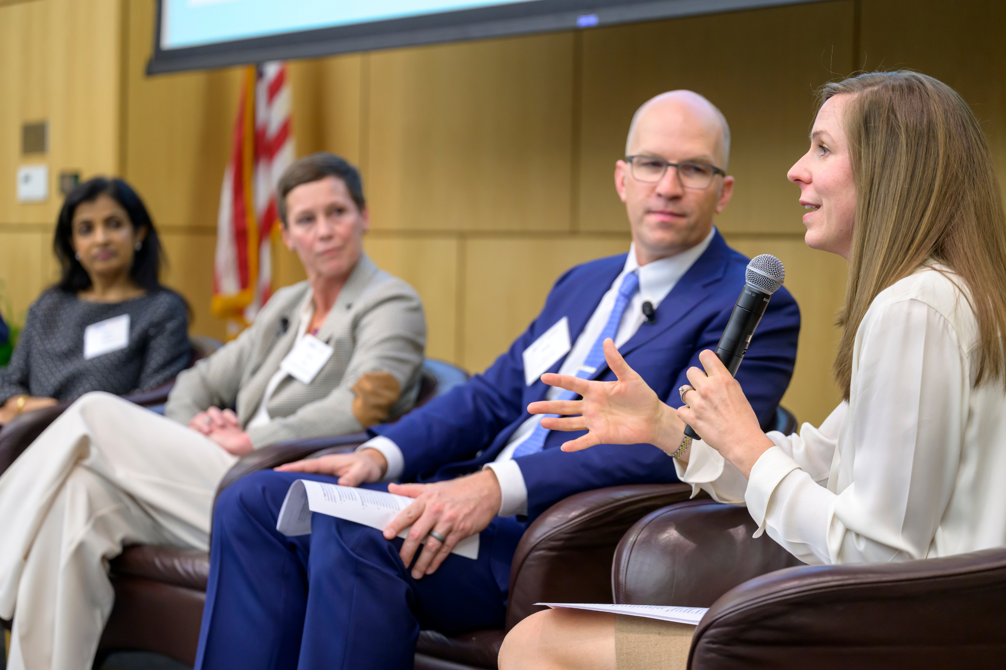panelists at the front of healthcare conference
