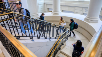 Students walking around Cox School