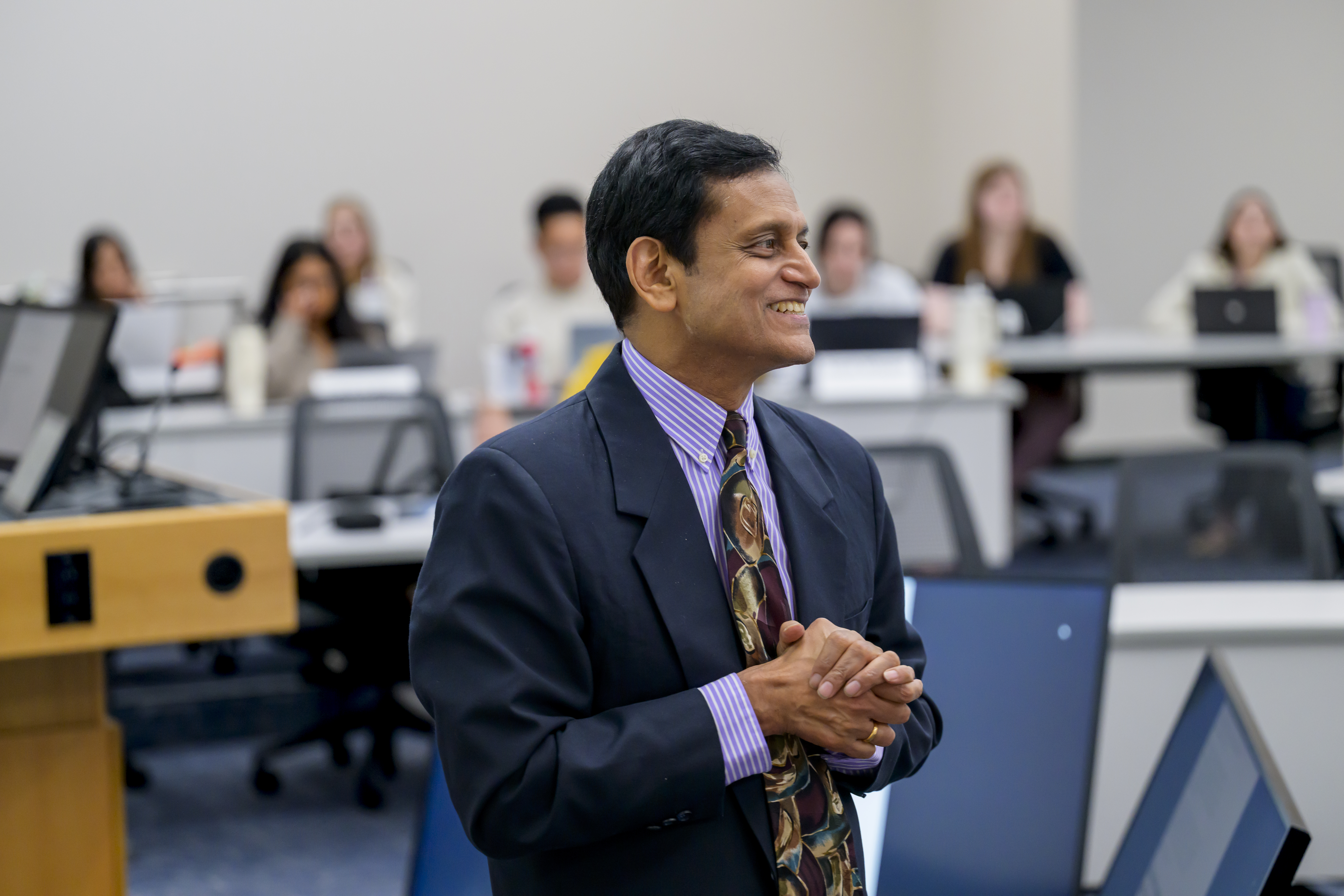 Photo of professor Venky Shankar mid-lecture