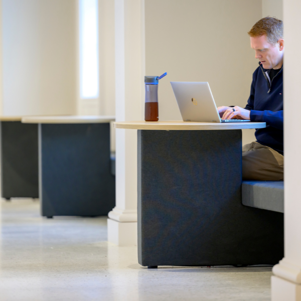 photo of student working on classwork at the Cox School