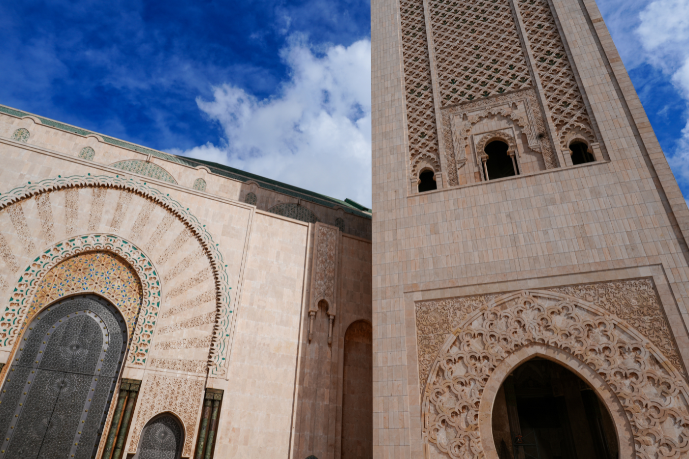 photo of building against blue sky with clouds
