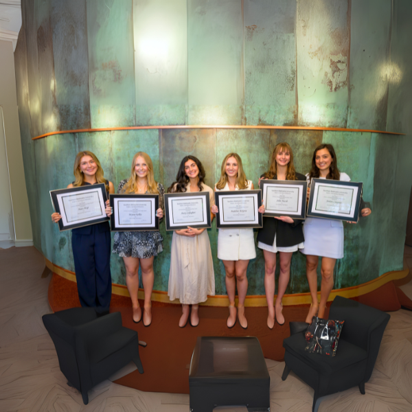 Students lined up in the Cox School with awards