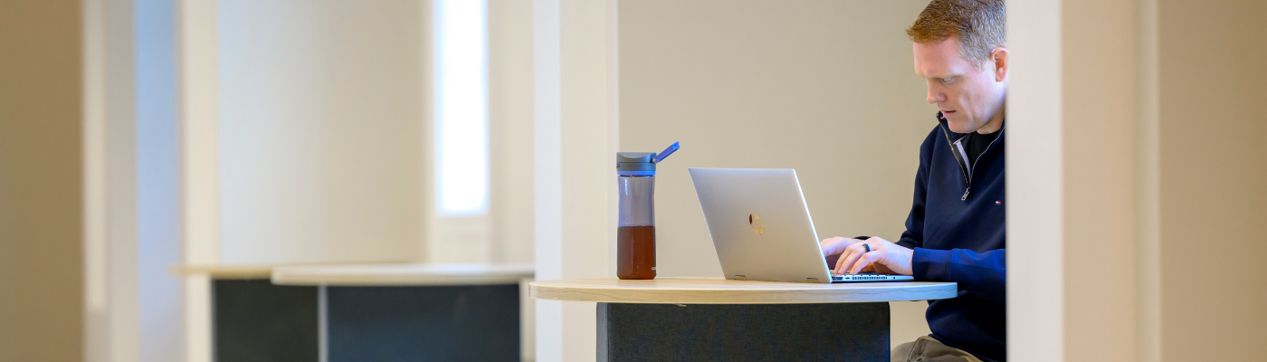 Student on laptop in the Cox School