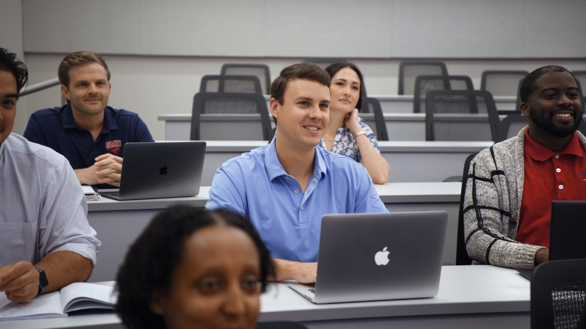 Students listening in an SMU Cox classroom.